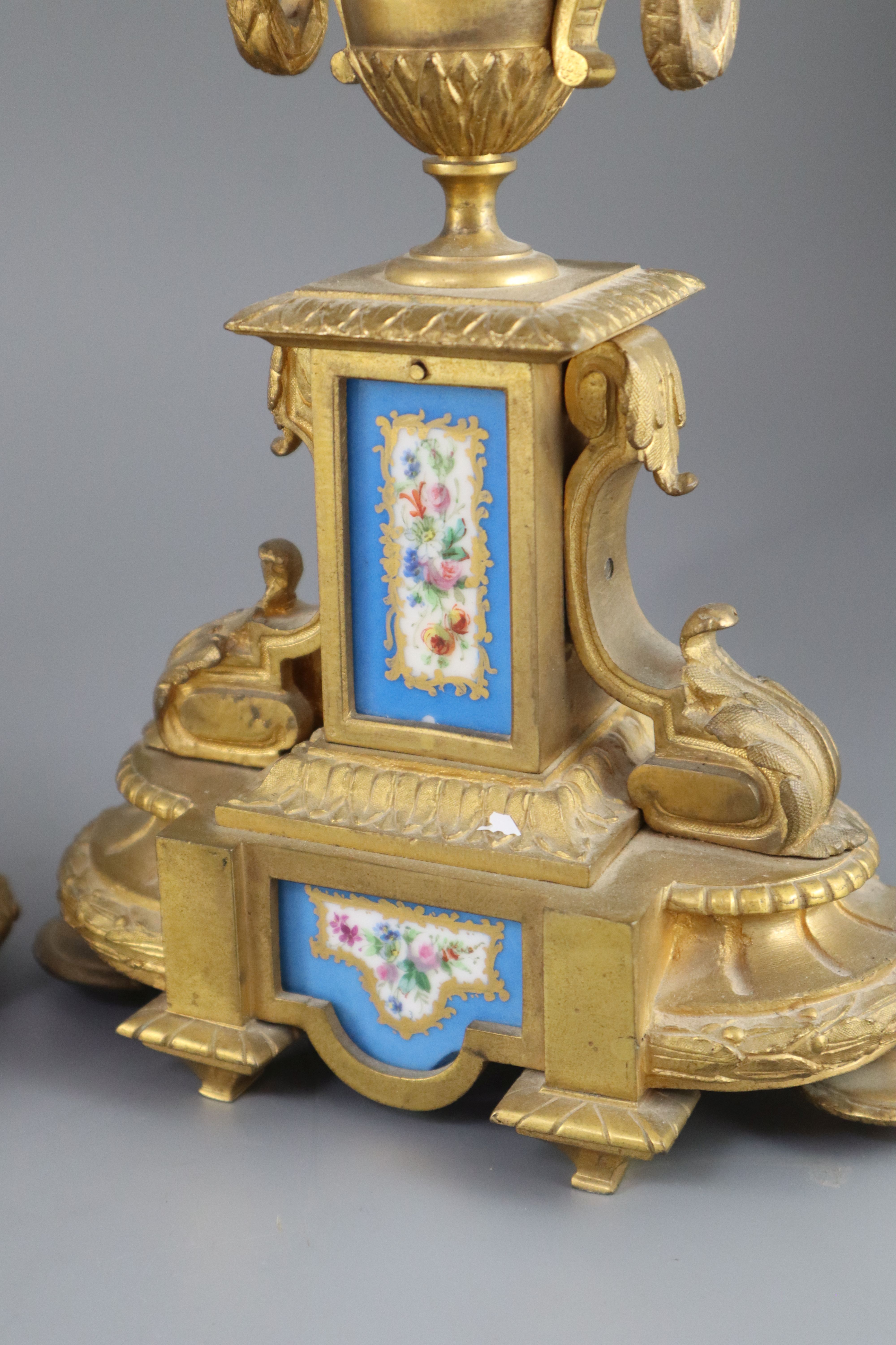 A 19th century Louis XVI style ormolu and Sevres style porcelain clock garniture, height 16.5in.